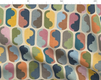 May include: A repeating pattern of colorful abstract shapes in shades of blue, green, yellow, orange, pink, and brown on a cream background. The shapes are arranged in a horizontal row and are reminiscent of mid-century modern design.