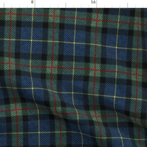 May include: A blue, green, black, red, and yellow plaid fabric with a subtle woven texture.