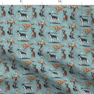 May include: A seamless pattern featuring a repeating design of greyhounds in various poses on a light blue background. The greyhounds are depicted in shades of brown, black, and white.