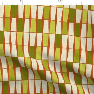 May include: Fabric with a repeating geometric pattern. The design features vertical columns of alternating colors: white, olive green, and a muted orange-red. The background has a textured, off-white appearance, creating a retro aesthetic.