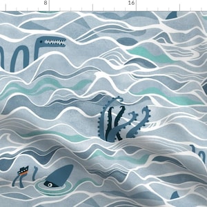 May include: A blue and white patterned fabric with a repeating design of sea creatures, including an octopus, a shark, and a sea serpent. The fabric has a watercolor-like effect.