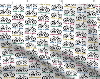 May include: A white background with a repeating pattern of black bicycles with the text "Ride a Bike" in various colors, including red, blue, yellow, and green.