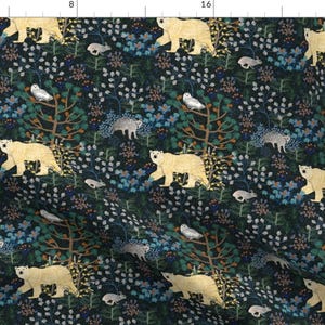 May include: A dark blue fabric with a repeating pattern of white polar bears, owls, and other woodland creatures. The pattern is surrounded by a variety of flowers and leaves in shades of blue, green, yellow, and pink.