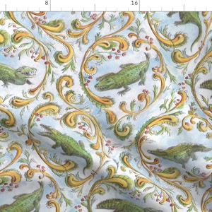 May include: A repeating pattern of green alligators on a white background with yellow and green floral designs. The alligators are facing different directions and are in various positions.