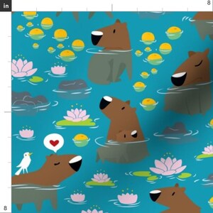 May include: A teal blue background with a repeating pattern of brown capybaras swimming in a pond with pink water lilies, yellow lily pads, and grey rocks. A white bird is perched on the head of one capybara.