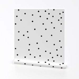 May include: White wallpaper with a black polka dot pattern.