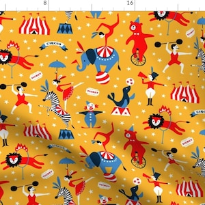May include: A yellow fabric with a repeating pattern of circus animals, clowns, and tents. The pattern includes a lion, elephant, zebra, seal, bear, and clown. The text "CIRCUS" and "TICKET" are repeated throughout the pattern.