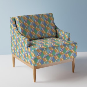 Könnte beinhalten: Ein blauer, grüner, orangefarbener und gelber Sessel mit Holzbeinen. Der Sessel hat ein geometrisches Design mit einem 3D-Effekt.