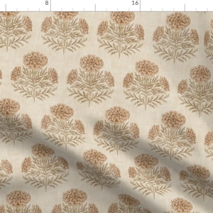 May include: A cream-coloured fabric featuring a repeating pattern of floral bouquets. Each bouquet has a central, round, peach-coloured flower surrounded by smaller blooms and detailed, light brown leaves. The design is symmetrical, creating a vintage aesthetic.