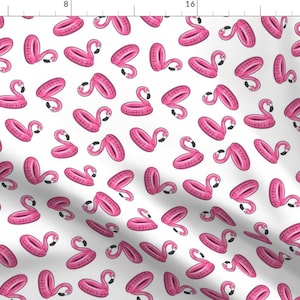 May include: A white background with a repeating pattern of pink inflatable flamingo pool floats. The flamingo floats are in a variety of positions, some with their heads up and some with their heads down.