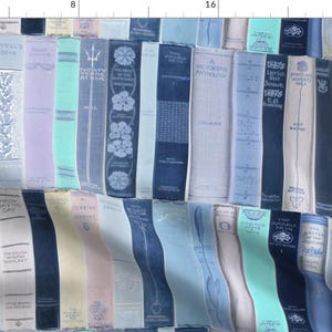 May include: A fabric design featuring a repeating pattern of vintage book spines in shades of blue, green, and beige. The spines have various titles and designs, creating a whimsical and literary aesthetic.