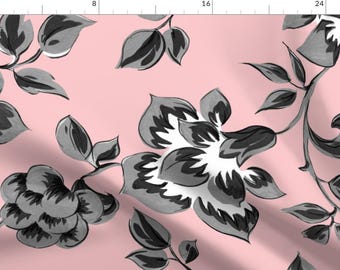 May include: A pink fabric with a repeating pattern of black and grey stylised flowers and leaves.