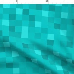 May include: A turquoise blue pixelated pattern with squares of varying shades of blue. The pattern is seamless and repeats.