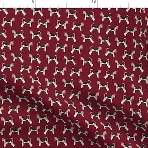 May include: A repeating pattern of wirehaired fox terrier dogs on a burgundy background. The dogs are black, white, and tan.