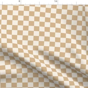 May include: A beige and white checkered pattern fabric. The fabric is folded and has a slight wrinkle.
