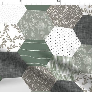 May include: A patchwork fabric design featuring a hexagonal pattern with various shades of green, brown, and white. The fabric features different patterns, including leaves, dots, and stripes.