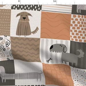 May include: A patchwork fabric design featuring various patterns and illustrations of dogs. The fabric is in shades of brown, gray, and orange. The patterns include swirls, zigzags, stripes, and polka dots.