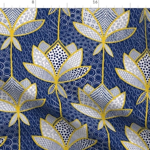 May include: A seamless pattern featuring stylized lotus flowers in shades of blue, white, and yellow on a navy blue background. The flowers are made up of various geometric shapes and patterns.