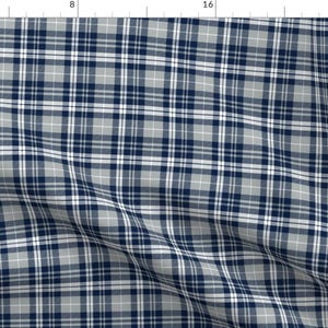 May include: A blue and white plaid fabric with a subtle grey undertone. The fabric has a woven texture and is perfect for crafting projects.