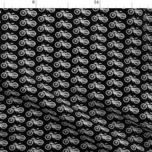May include: A black and white fabric pattern featuring a repeating design of vintage motorcycles. The motorcycles are outlined in white against a black background.