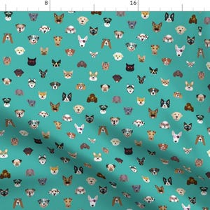 May include: A teal blue fabric with a repeating pattern of various dog breeds wearing sunglasses. The dogs are all facing forward and have different colored fur and eye colors.