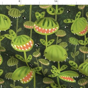Peut inclure: Un tissu vert avec un motif répété de plantes vertes de dessin animé avec des bouches dentées. Les plantes ont un fond vert avec de petites abeilles noires.
