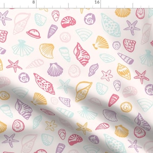 May include: A fabric with a repeating pattern of seashells and starfish in pastel colors. The design includes various shell shapes in pink, yellow, purple, and blue, set against a cream background. The fabric is suitable for coastal or beach-themed projects.