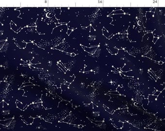 May include: A navy blue fabric with a white constellation pattern. The constellations are outlined in white and are scattered across the fabric. The fabric is perfect for crafting projects, such as quilts, pillows, and clothing.
