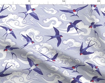 May include: A seamless pattern featuring purple swallows flying against a light purple background with white stylized clouds. The swallows have red beaks and red accents on their wings.
