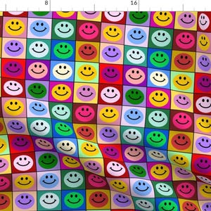 May include: A colourful pattern of smiley faces in a grid. Each smiley face is surrounded by a square of a different colour, creating a vibrant and playful design.