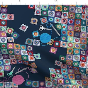 May include: A colorful crochet pattern with various shades of blue, green, red, yellow, and purple. The pattern is made up of squares with a starburst design in the center. There are also crochet hooks, scissors, and yarn balls scattered around the pattern.