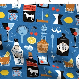 May include: A blue fabric pattern featuring cocktail-themed illustrations. The design includes bottles of gin and whiskey, martini glasses, lemons, cherries, ice cubes, and cocktail shakers. The words "GIN" and "SCOTCH WHISKEY" are visible.