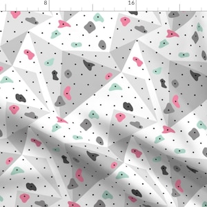 May include: A white background with a geometric pattern of gray triangles. The triangles are dotted with small black dots. There are also pink and light green shapes scattered throughout the pattern.