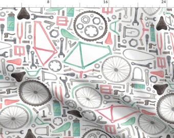 May include: A seamless pattern featuring a variety of bicycle parts and tools in watercolor. The design includes a bicycle frame, wheels, handlebars, gears, wrenches, and other tools in shades of gray, green, and pink.