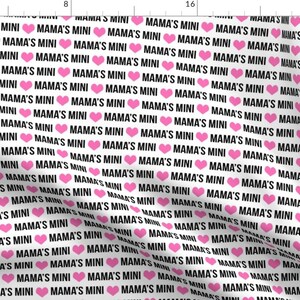 May include: White fabric with a repeating pattern of pink hearts and the text "Mama's Mini" in black.