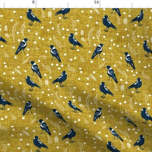May include: A yellow fabric with a repeating pattern of black and white birds. The birds are stylised and have a simple design. The background is a yellow colour with white dots.