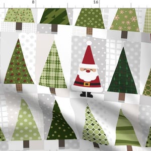 May include: A festive fabric pattern featuring Christmas trees in various green patterns and a Santa Claus illustration. The trees have brown trunks and are set against a grey and white background with polka dots and grid patterns.