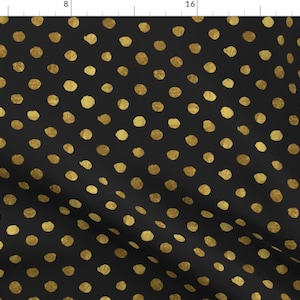 May include: Black fabric with a repeating pattern of gold polka dots.