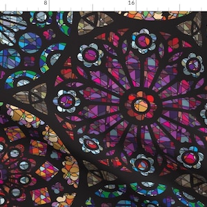 May include: A colorful stained glass pattern with a black background. The pattern features a repeating design of flowers with intricate details.