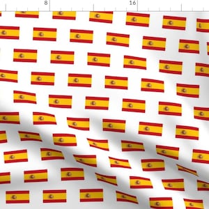 May include: A white background with a repeating pattern of the Spanish flag. The flag is red and yellow with a coat of arms in the center.