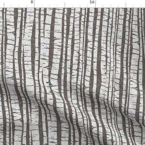 May include: A seamless pattern featuring a repeating design of dark gray tree trunks against a white background. The pattern resembles a forest of birch trees.