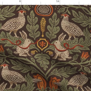 May include: Dark brown fabric with a repeating pattern of birds, rabbits, and foliage. The design includes white birds with red accents, white rabbits, green leaves, and orange flowers. The fabric has a vintage, botanical theme.