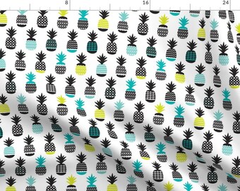 May include: White fabric with a repeating pattern of stylized pineapples. The pineapples are in various colors, including black, teal, and yellow-green. The pineapple crowns are black.
