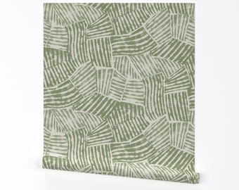 May include: Green and white patterned wallpaper with a geometric design. The pattern is made up of overlapping squares with stripes.