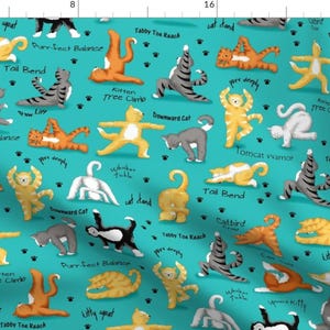 May include: A turquoise blue fabric with a repeating pattern of cats in various yoga poses. Each cat is illustrated with a different color and has a name for the pose written below it. The poses include: Purr-fect Balance, Litty Squat, Tail Bend, Kitten Tree Climb, Downward Cat, Tomcat Warrior, Tall Bend, Catbird Crow, Whinker Tuck, Cat Stand, Tabby Toe Reach, and Purr Deeply.