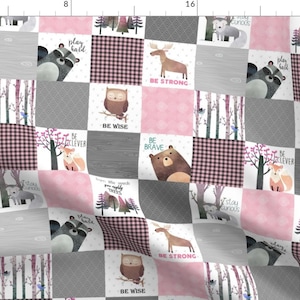 May include: A pink and gray patchwork fabric with woodland animal illustrations and inspirational phrases like "Be Strong", "Be Wise", and "Be Brave".