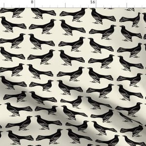 May include: A seamless pattern featuring black silhouettes of birds on a cream background. The birds are arranged in a repeating pattern, with each bird facing a different direction.