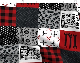 May include: A red and black plaid fabric with a patchwork design. The fabric features different patterns, including a black and white checkered pattern, a gray pattern with wrenches and nuts, and a white pattern with red wrenches and screwdrivers. The fabric also includes the text "BUILD IT TUNE IT RACK IT BREAK IT FIX IT REPEAT".