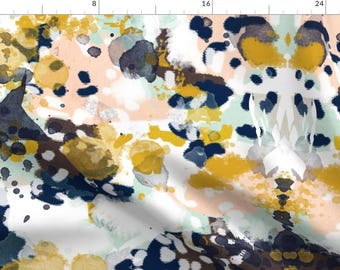 May include: Abstract watercolor pattern in shades of navy blue, mustard yellow, peach, and white. The pattern is a repeating design of splattered paint.