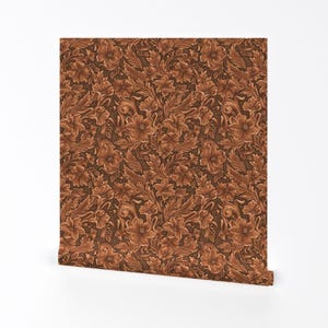 May include: A brown and tan floral patterned wallpaper with a repeating design of flowers and leaves.